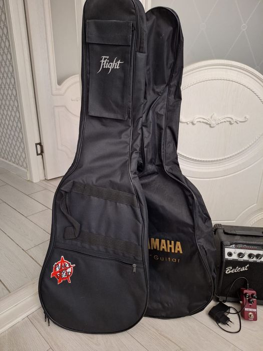 Гитара в наборе + струны в подарок!