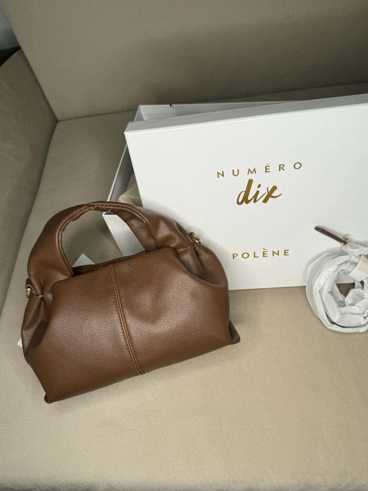 Нова дамска чанта Polène Numéro Neuf Mini
Моделът е изработен от висококачествена естествена кожа, която придава усещ