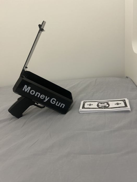 Pistol de aruncat bani (57 de bancnote incluse)