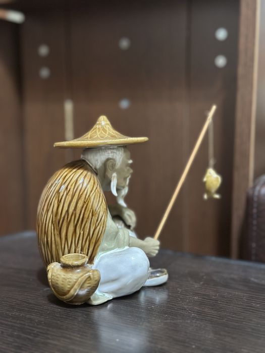 bibelou chinezesc cu undita si peste