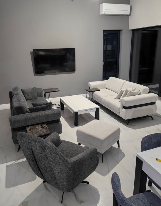 Два дивана троика, кресло и табуретка.