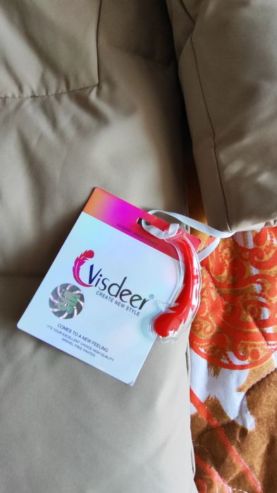 Новый пуховик 48 размера