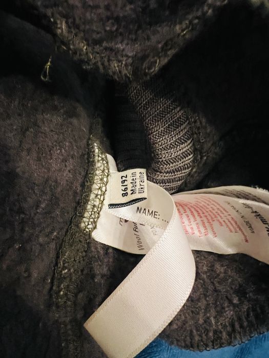 Cagula cu ciucuri Mikk-Line din lana fleece organica