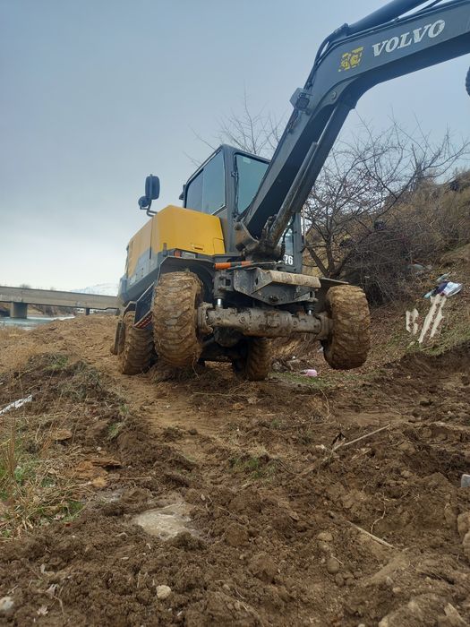 Экскаватор  хизмати