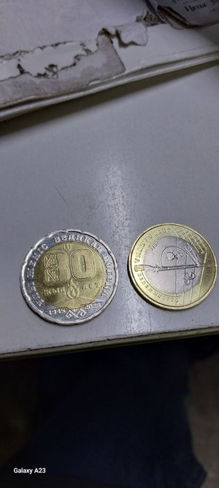 Продам манеты 100 тг, 200 тг