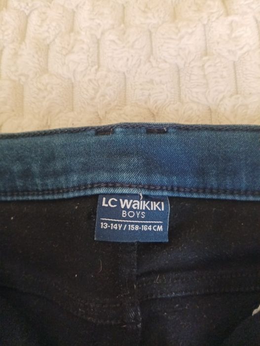 Джинсы на подростка 13-14 лет .