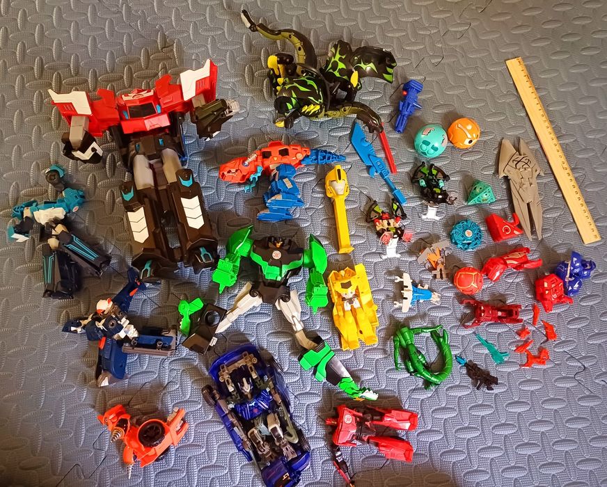 Игрушки динозавры трансформеры роботы