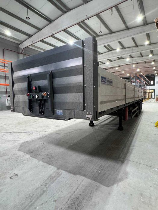 Бортовой открытый полуприцеп-контейнеровоз УАТ.