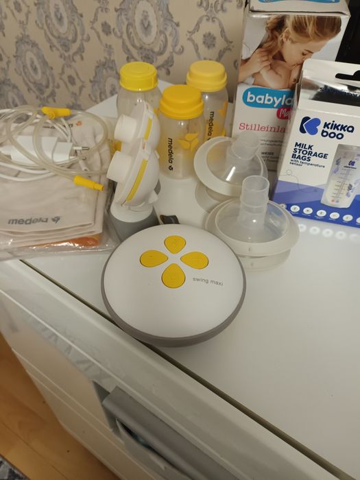 Помпа за кърмене medela swing maxi