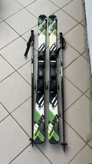 Schiuri Elan Pro 140 cm + bețe SWIX + Clăpari Nordica Firearrow Team 2 (mărimea 235 / 23.5 MP) - set complet