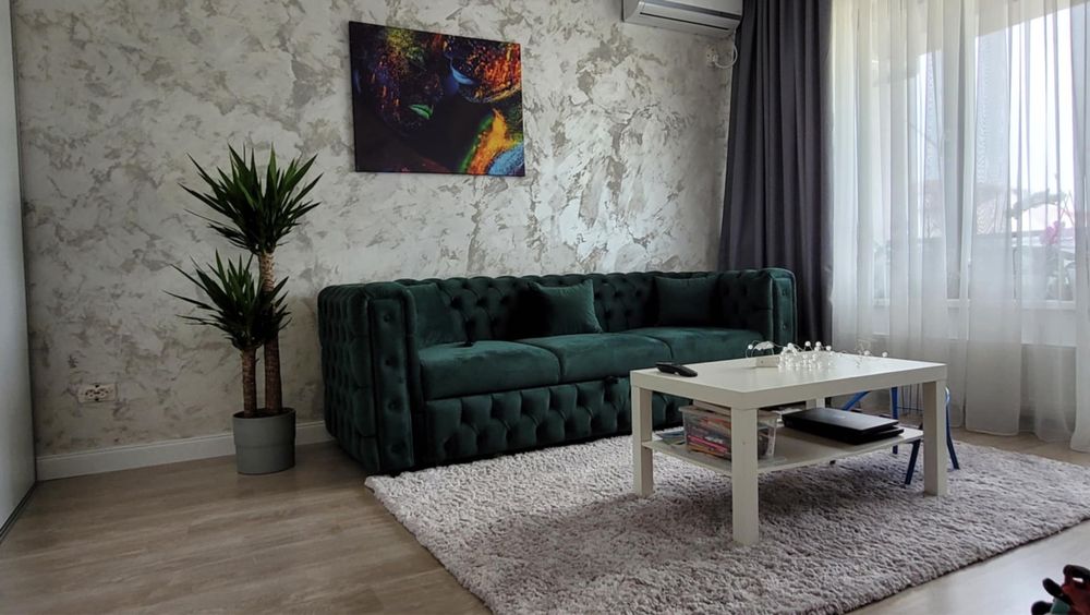 Canapea extensibila Chesterfield verde smarald