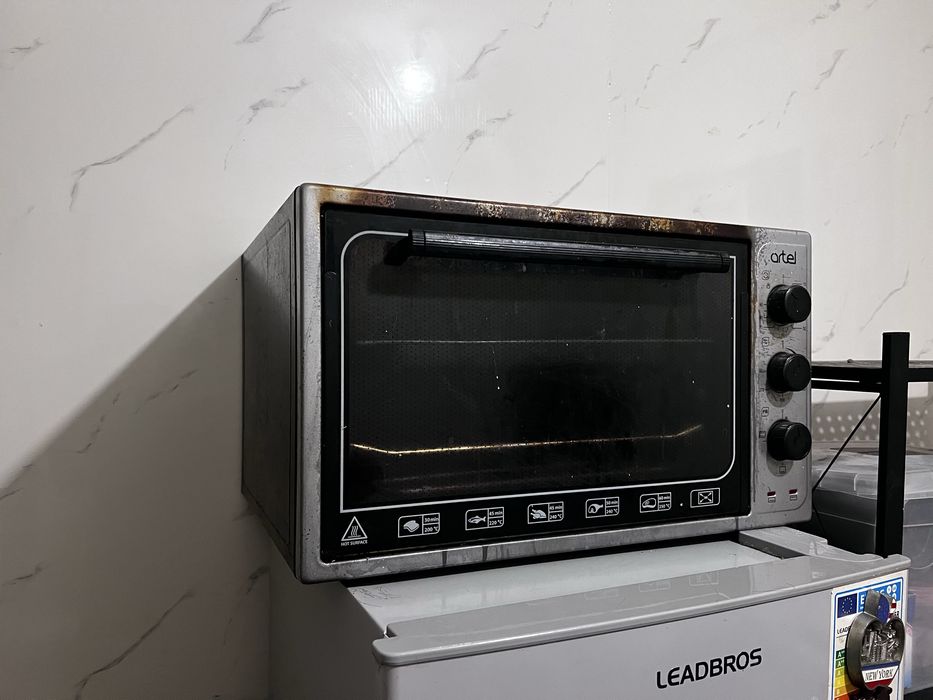 Продается духовка  Artel MD 3618 E серый, черный