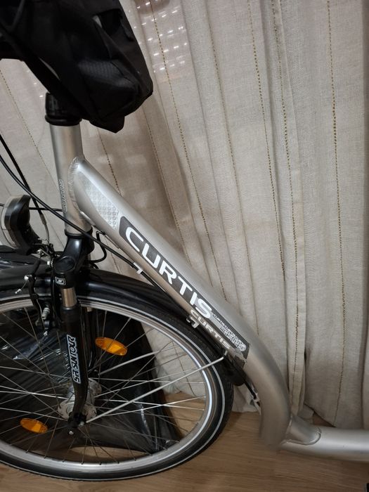 Bicicletă CURTIS City | Aluminiu | Suspensie | Dinam | Coș | Stare foarte bună