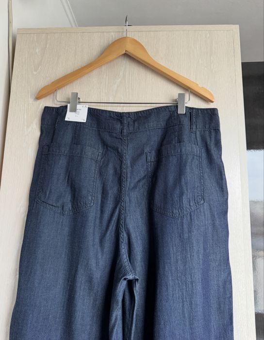 Pantaloni evazati aspect denim XL Mango