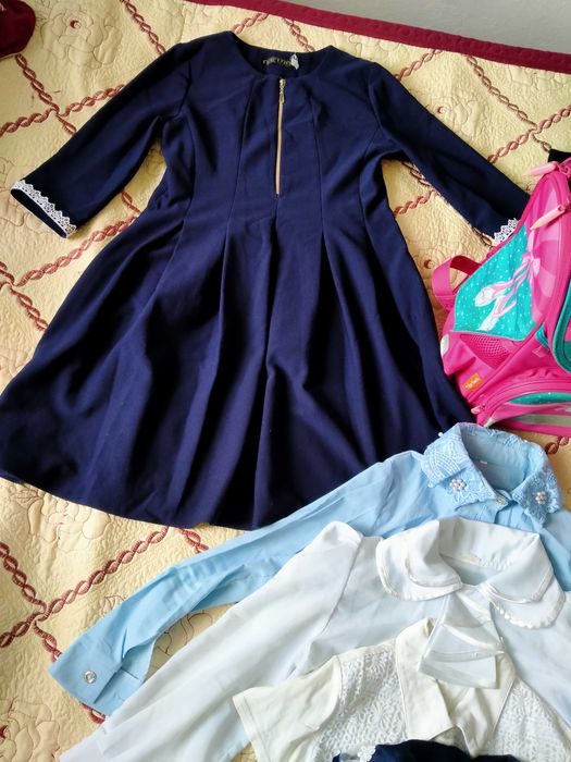 Продам школьный рюкзак и одежду