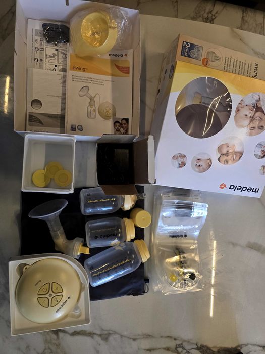 Молокотсос Medela Swing