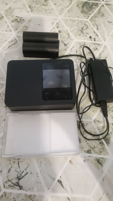 Vând imprimanta canon selphy CP1500 cu accesorii complete