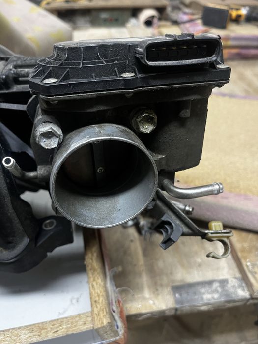 Дросильная заслонка