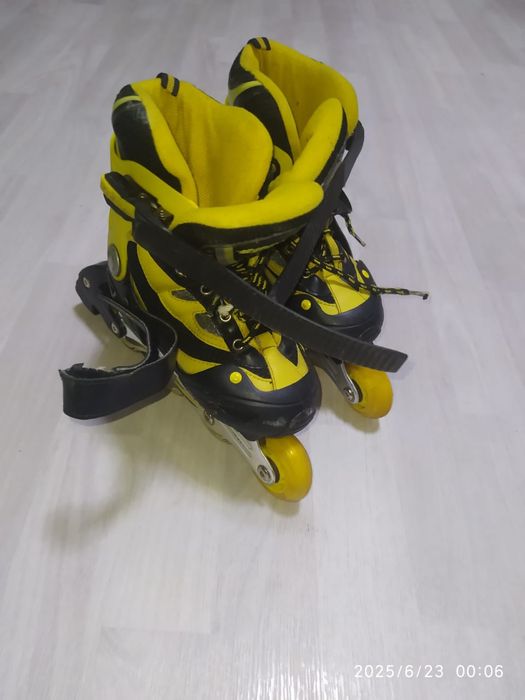 Роликовые коньки