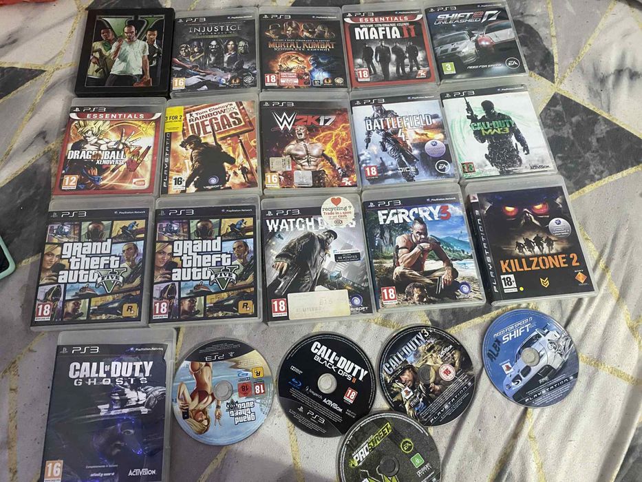 PlayStation 3 Slim + 2 manete + 21 jocuri – pachet complet