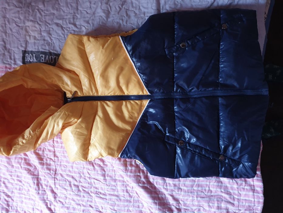 Пуховая жилетка новая