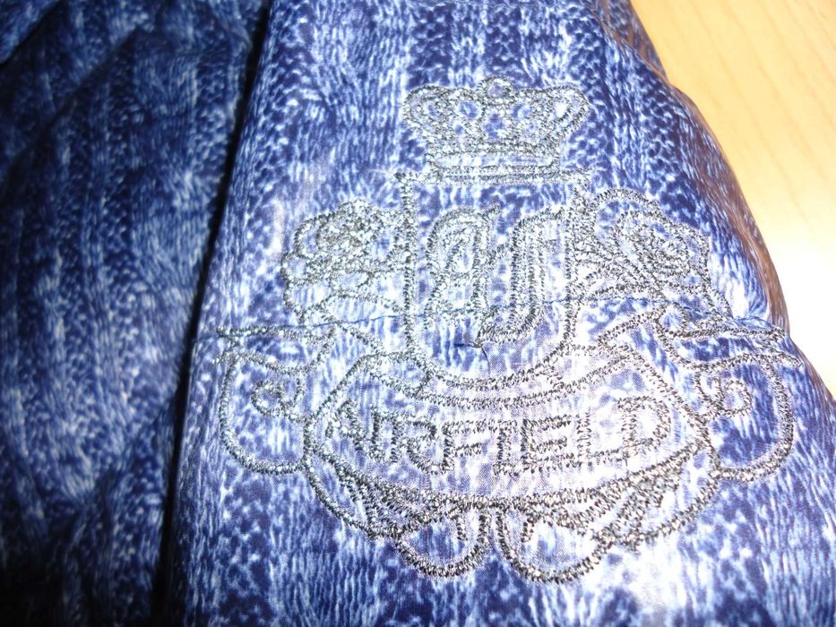 Продам Фирменный пуховик