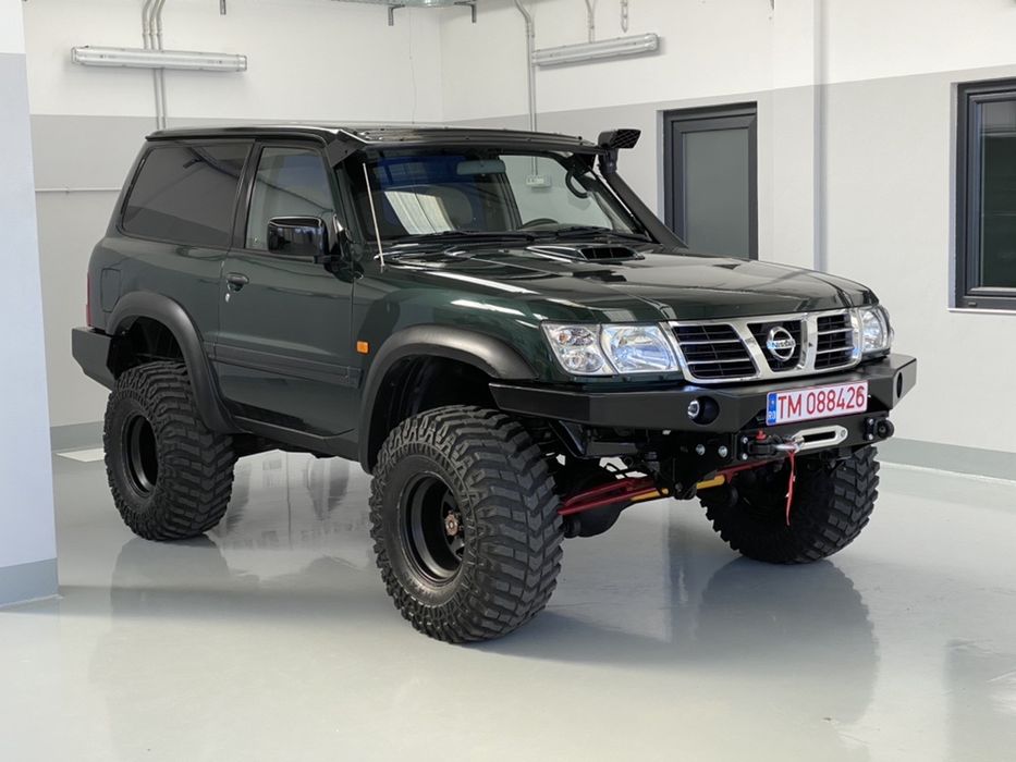 Bara fata Nissan Patrol Y61 cu suport de troliu