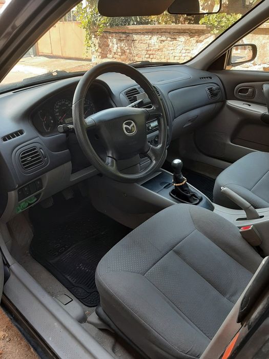 Mazda 323f, бензин 1.3- 72к.с