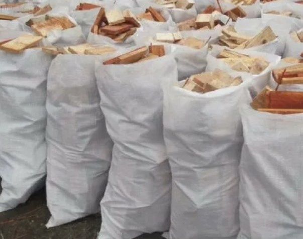 Дрова рубленный в мешках