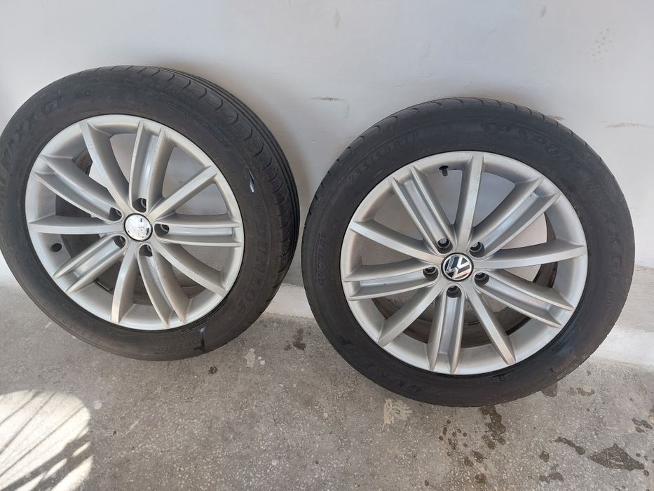 4 jante Volkswagen  aluminiu cu tot cu anvelope  de vara Dunlop
