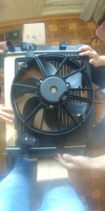 Вентилятор в сборе на логан 1