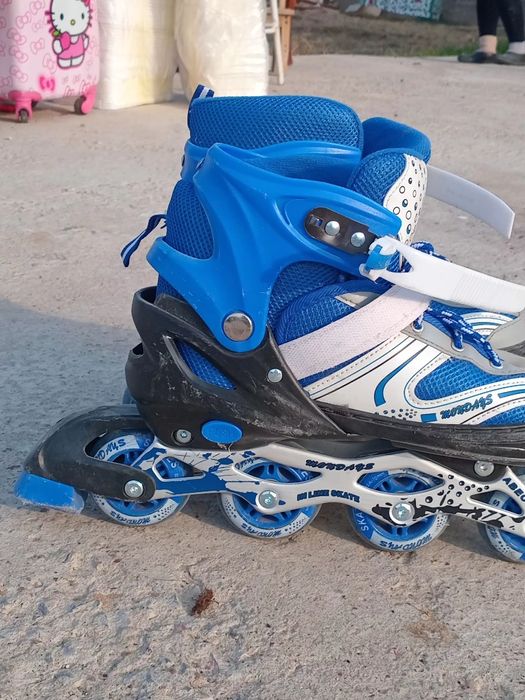 Роликовые коньки