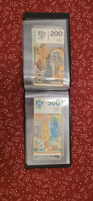 Vand album cu 20 bancnote.