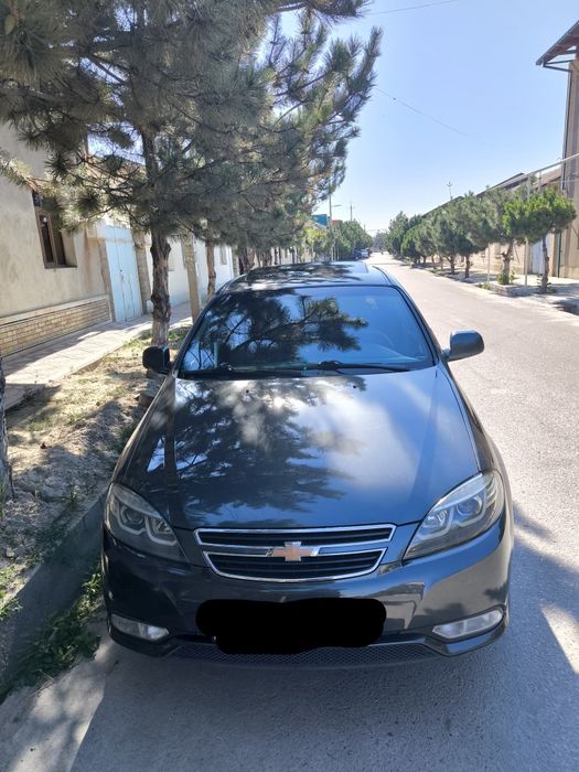 Продаётся chevrolet gentra мокрый цвет  асфальт