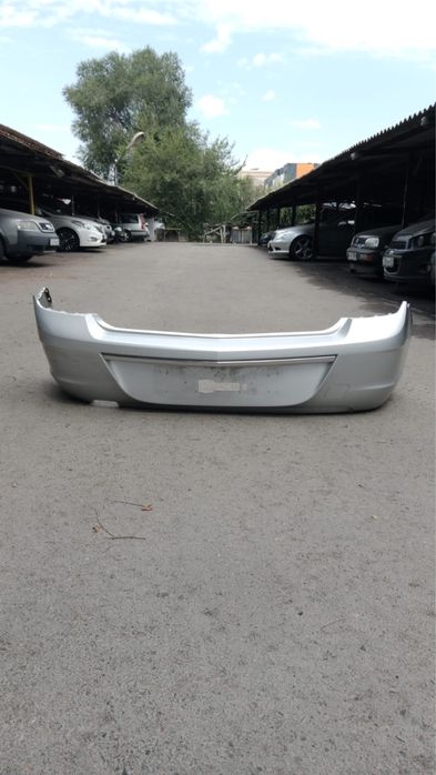 Продам задний бампер от Шевроле Кобальт серебристого цвета