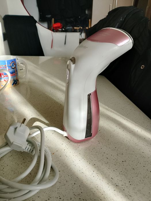 Mașina de călcat vertical cu abur