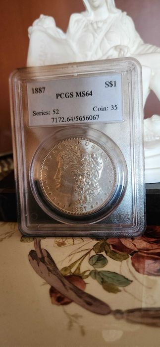 Monedă Morgan Dollar 1887 – Argint – PCGS MS64 – Philadelphia Mint