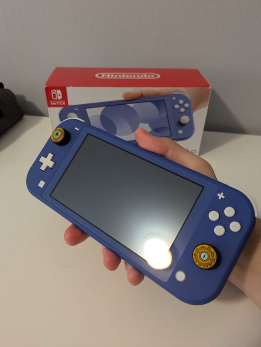 Nintendo switch lite ca nou + card Kingston 128gb