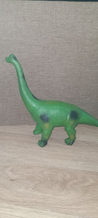 Детская игрушка динозавр