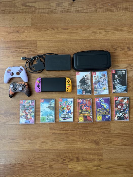 Nintendo Switch OLED + 9 jocuri + accesorii