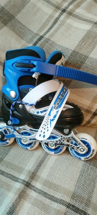 Роликовые коньки