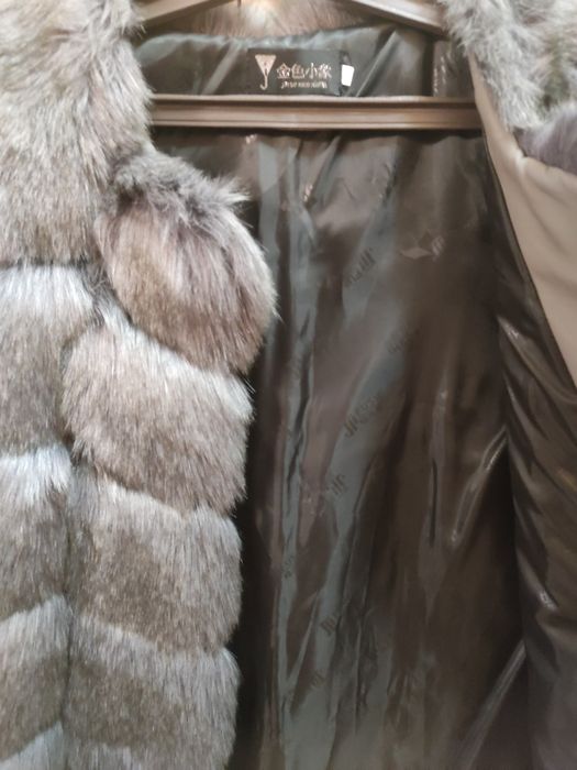 Продам новую меховую жилетку
