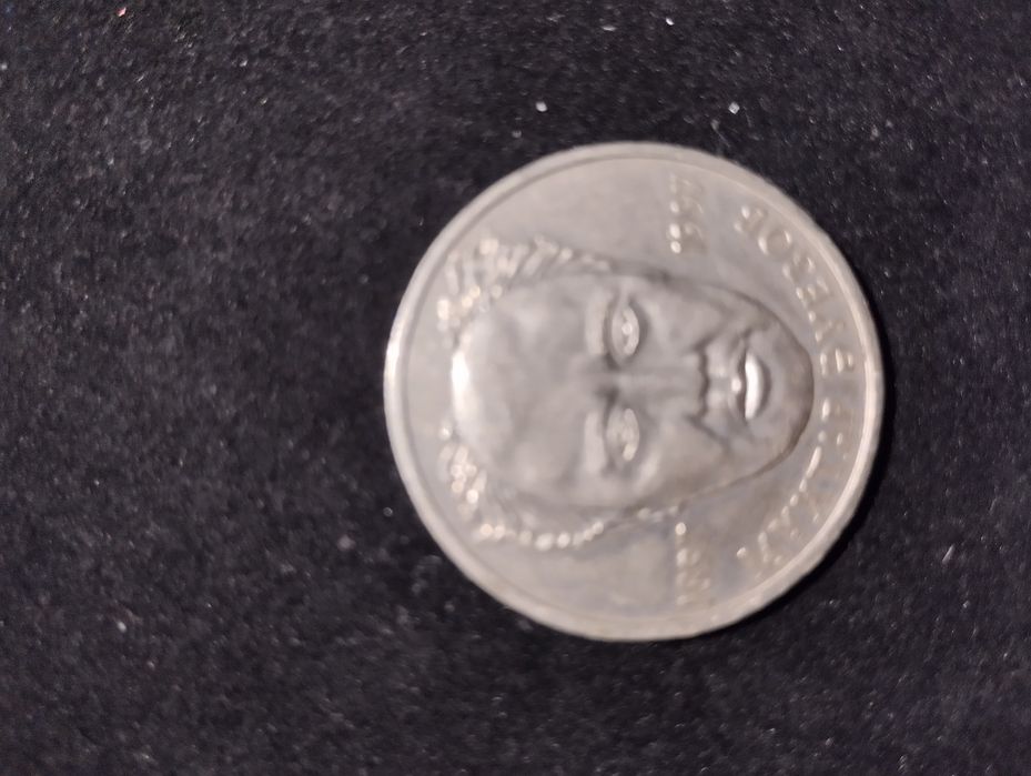 Монета с Мухтаром Ауэзовым