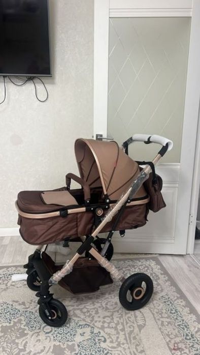 Продам коляску и ходунок