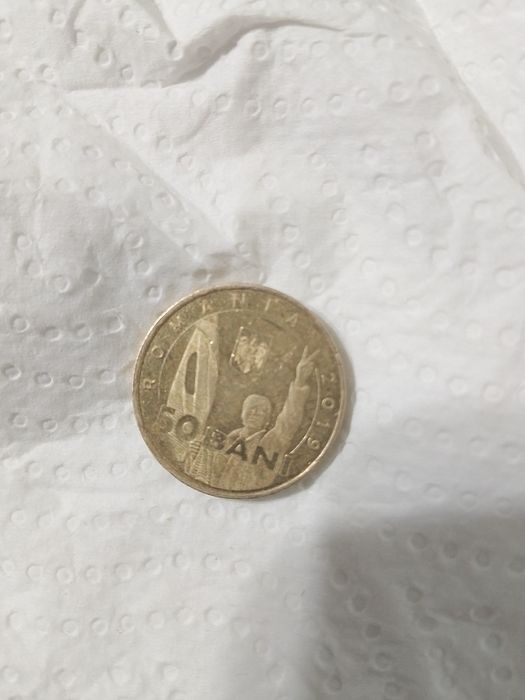 Vând moneda de 50 de bani din revoluția 1989
