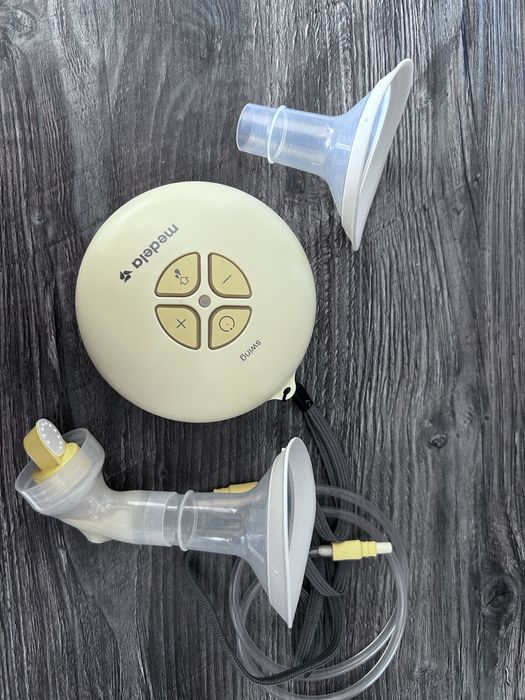 Помпа за кърма Медела medela с два неизползвани на