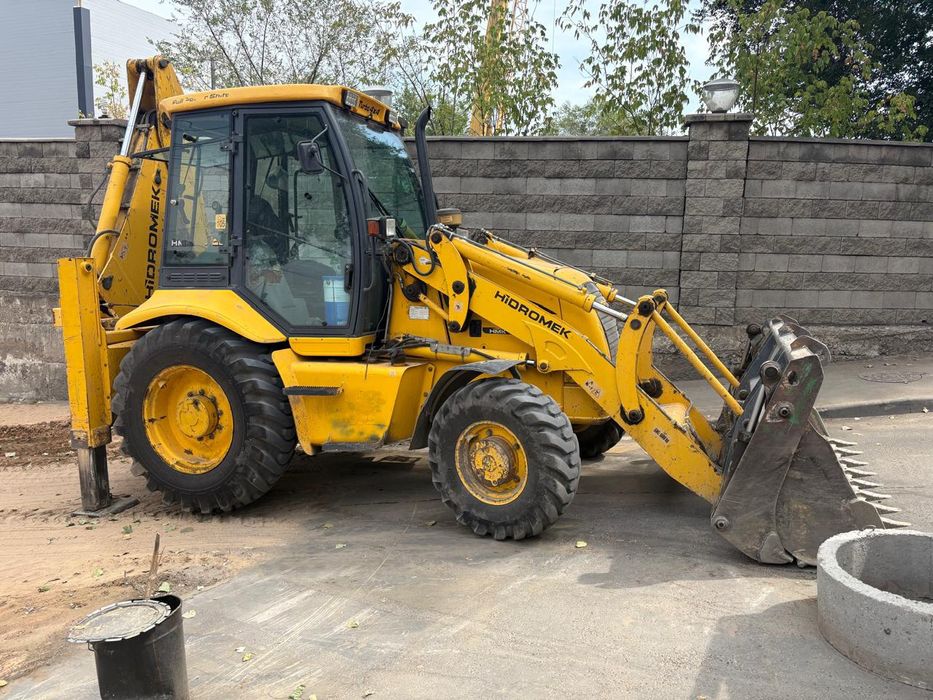 Экскаватор погрузчик 3в1