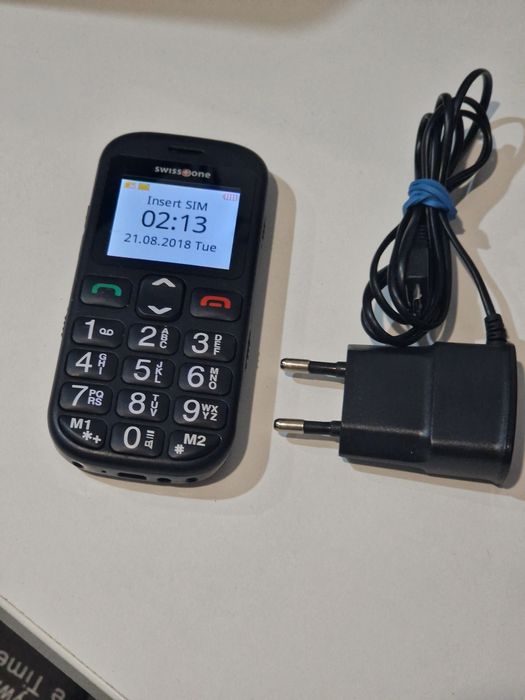 Telefon cu butoane cu încărcător