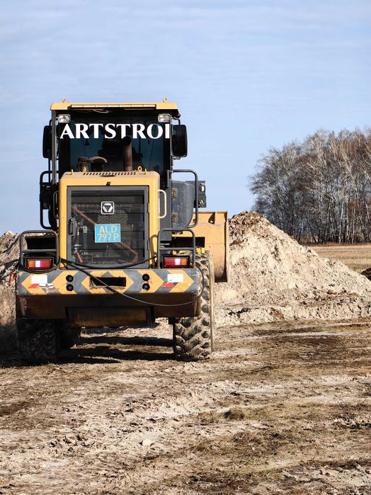 Фронтальный погрузчик.