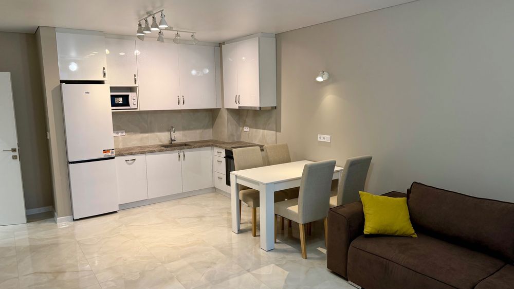 Нов двустаен апартамент с морска гледка + подземен паркинг